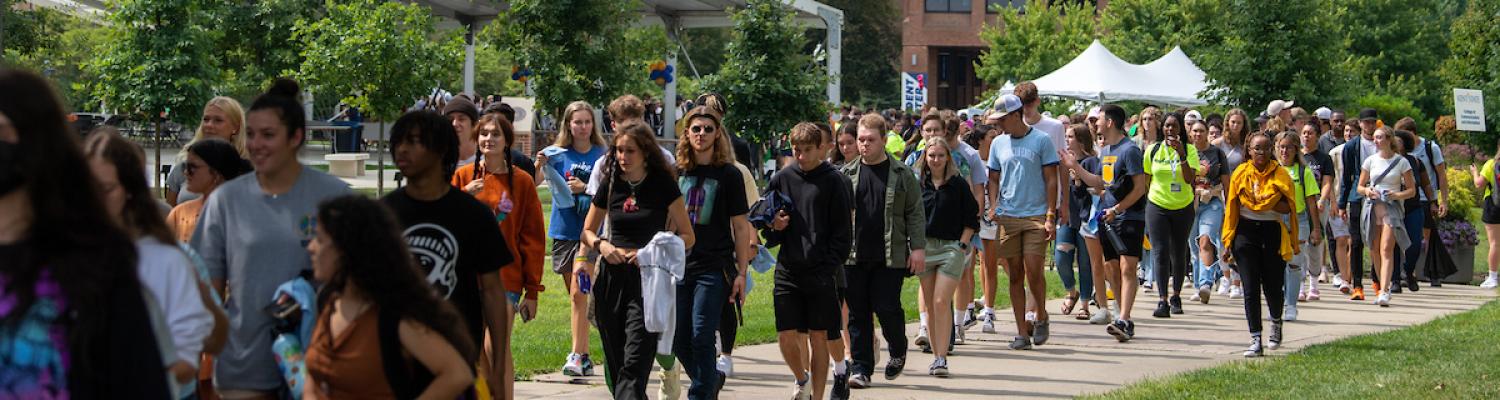 Kent State University students from the Class of 2026 walk across Manchester Field.
