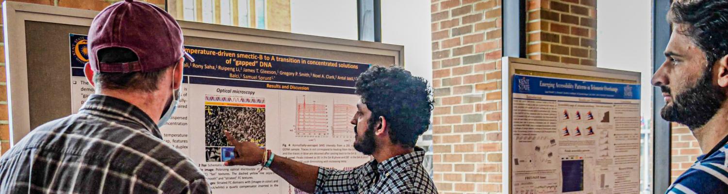 Student presents a poster at the 2022 Graduate Symposium