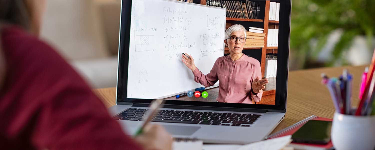 Online Teaching professor on laptop computer teaching student virtually digitally