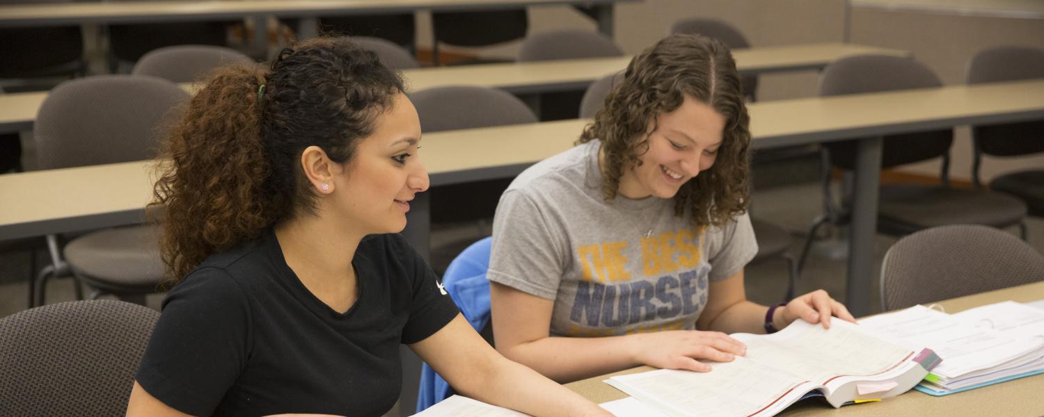 Two female Kent State Ashtabula students take part in a study session in Robert S. Morrison Hall