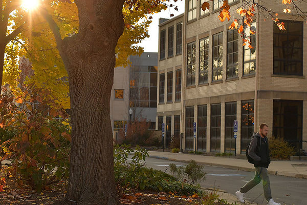 Students walk between Risman Plaza and the University Library.
