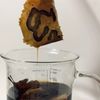 BioBlack tests a swatch in a beaker filled with tannins
