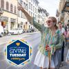 Two girls walking on a sidewalk. Logo of Giving Tuesday
